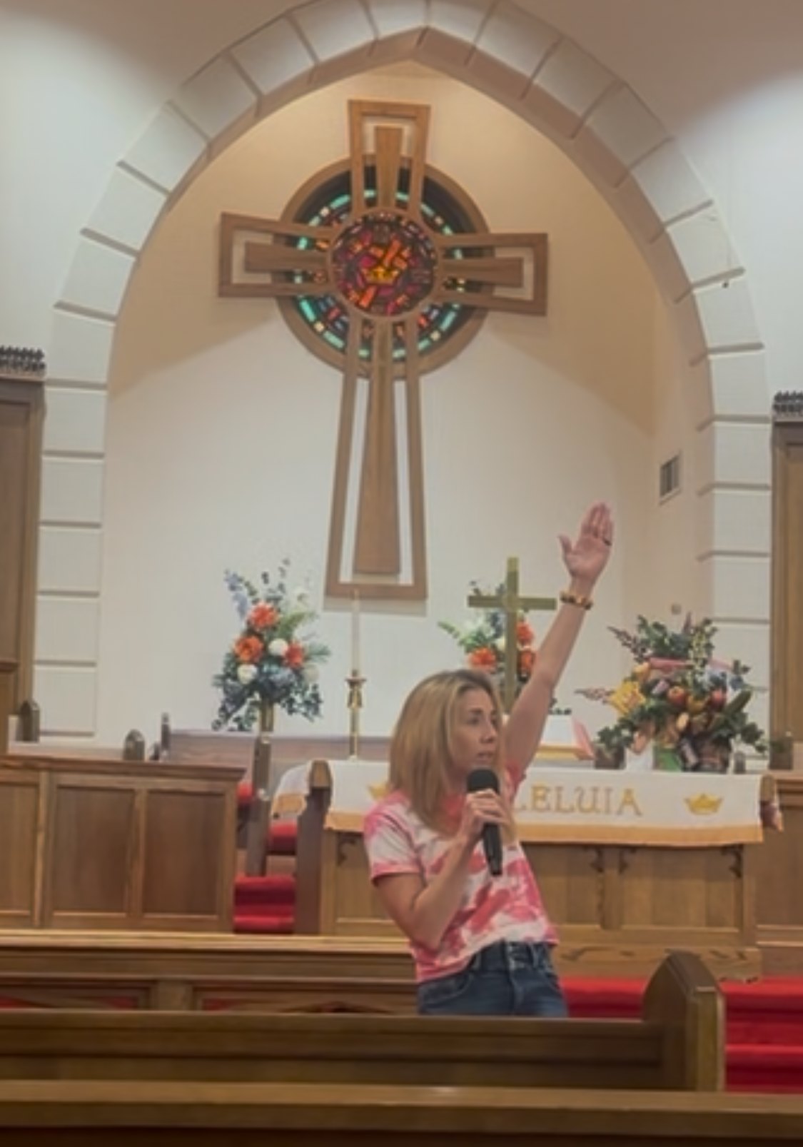Praying from the front of a sanctuary